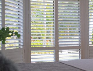 White plantation shutters in a bedroom in Wollongong, NSW
