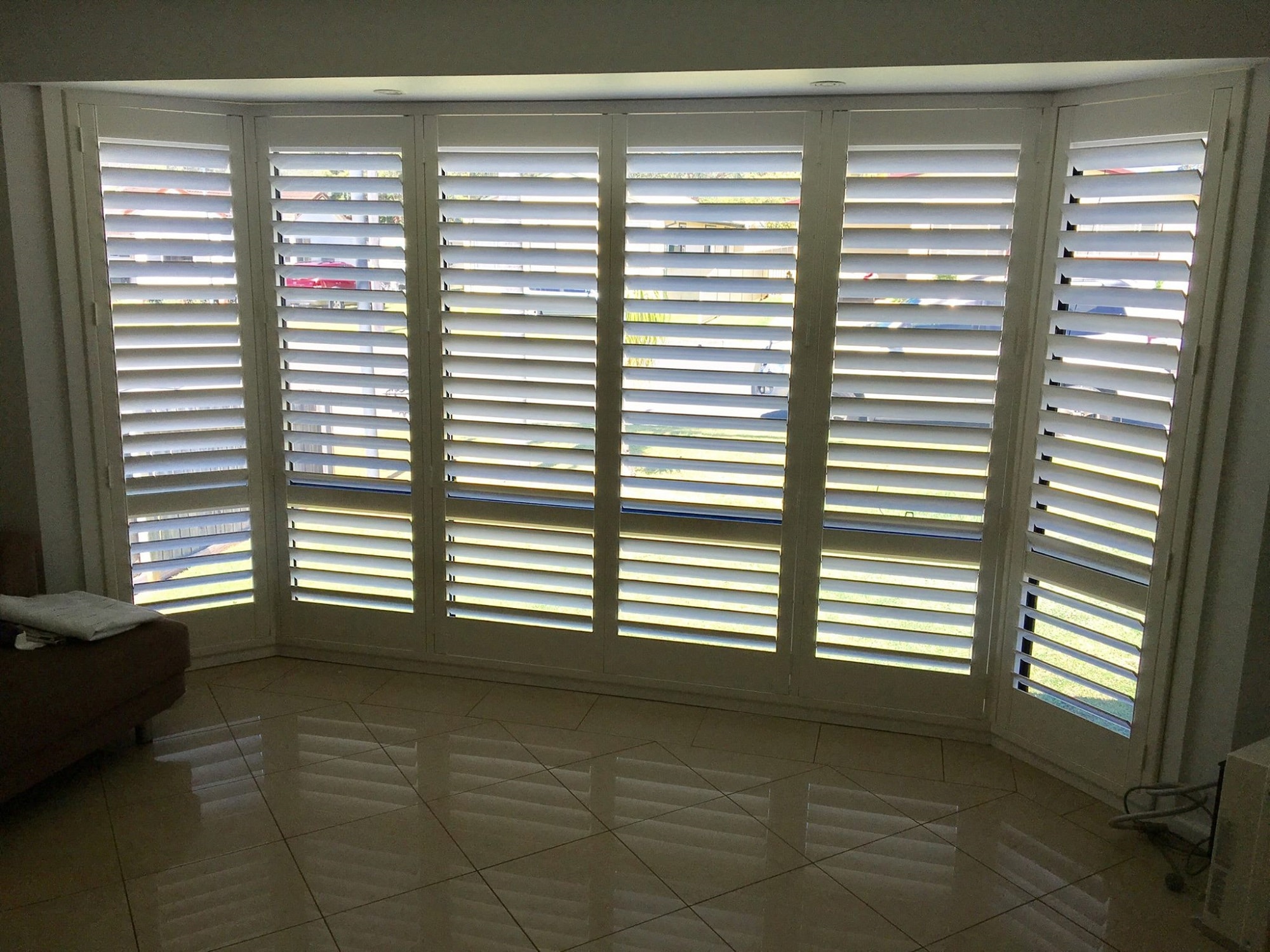 Bay window with white plantation shutters in Nowra, NSW