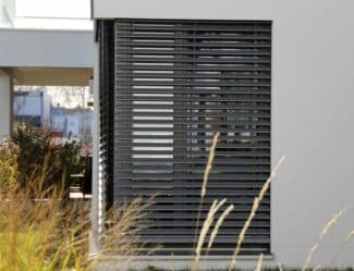 Window With Grey Exterior Shutters