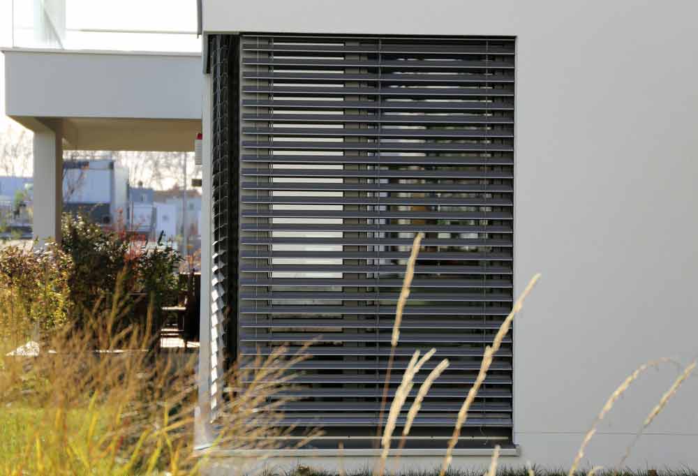Window With Grey Exterior Shutters