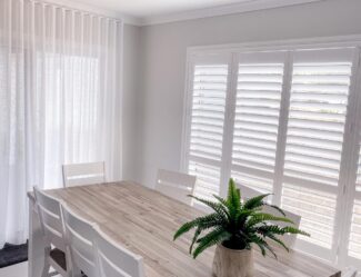 Dining Room With White Plantation Shutters