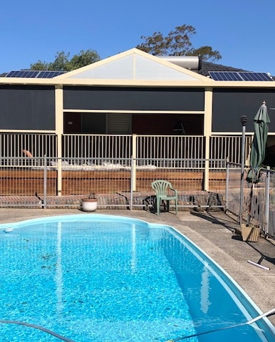 Outdoor zipscreen Awning by a pool in Albion Park Rail, NSW