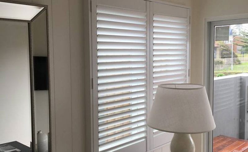 White plantation shutters in living room in Oaks Flat, NSW